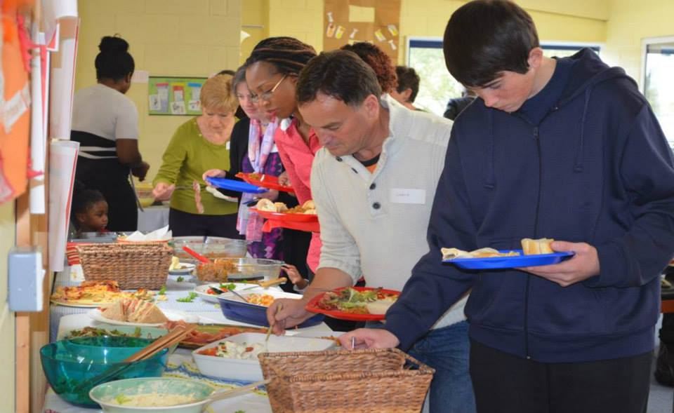 Delegates serving themselves at the fellowship lunch
