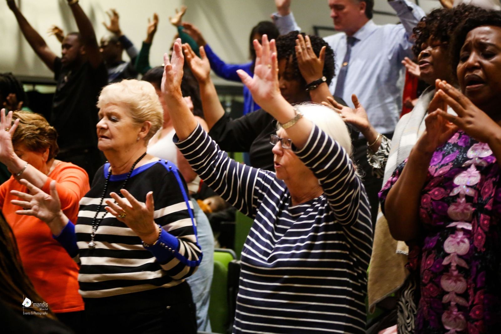 Women of different generations rejoicing in worship